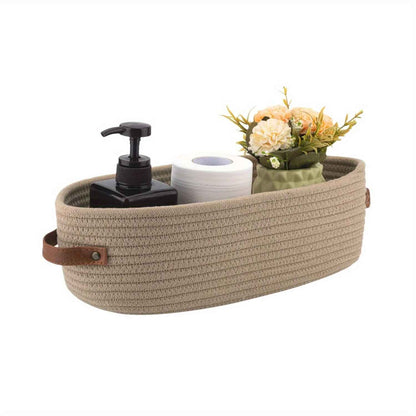 panier de rangement salle de bain ovale beige avec produits toilette