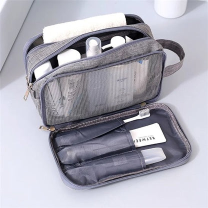 Trousse de toilette grise ouverte compartiment brosse à dent