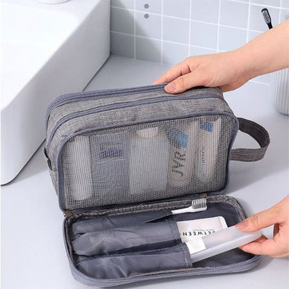 Trousse de toilette grise ouverte rangement dentifrice