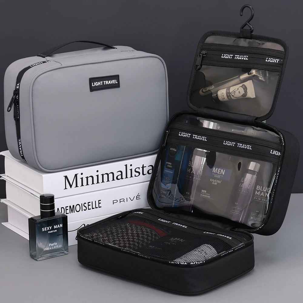 trousse de toilette homme rigide presentation noir et grise sur livres