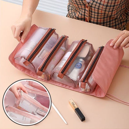 trousse pour maquillage multi-pochettes ouverte rose sur comptoir