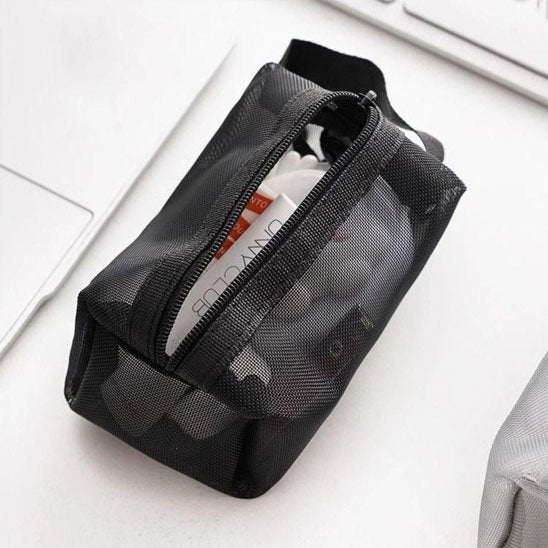 Trousses maquillage  en tissus transparent ouverte